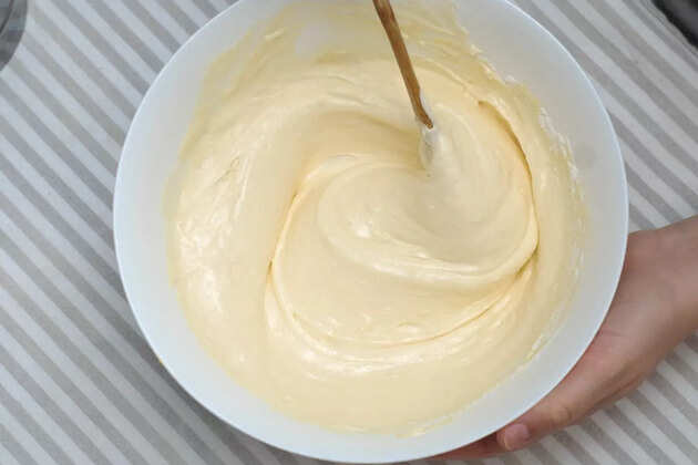 mixing-baking-dough-for-waffles-egg-yolks-and-milk-in-a-glass-bowl-picture-id935320916