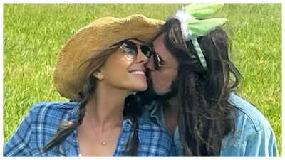 Elizabeth Hurley and Billy Ray Cyrus spark dating rumours as they KISS in romantic Easter pic